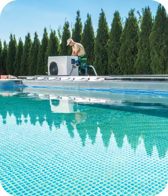 Man repairing a pool heat pump beside a large pool