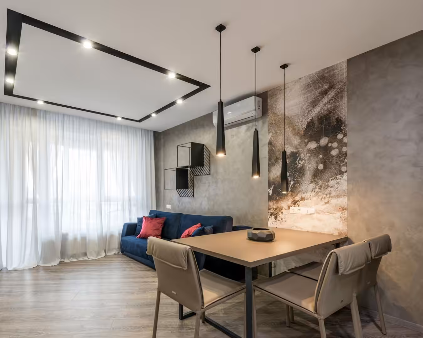 Cozy dining area with a chandelier, table, sofa, and chairs