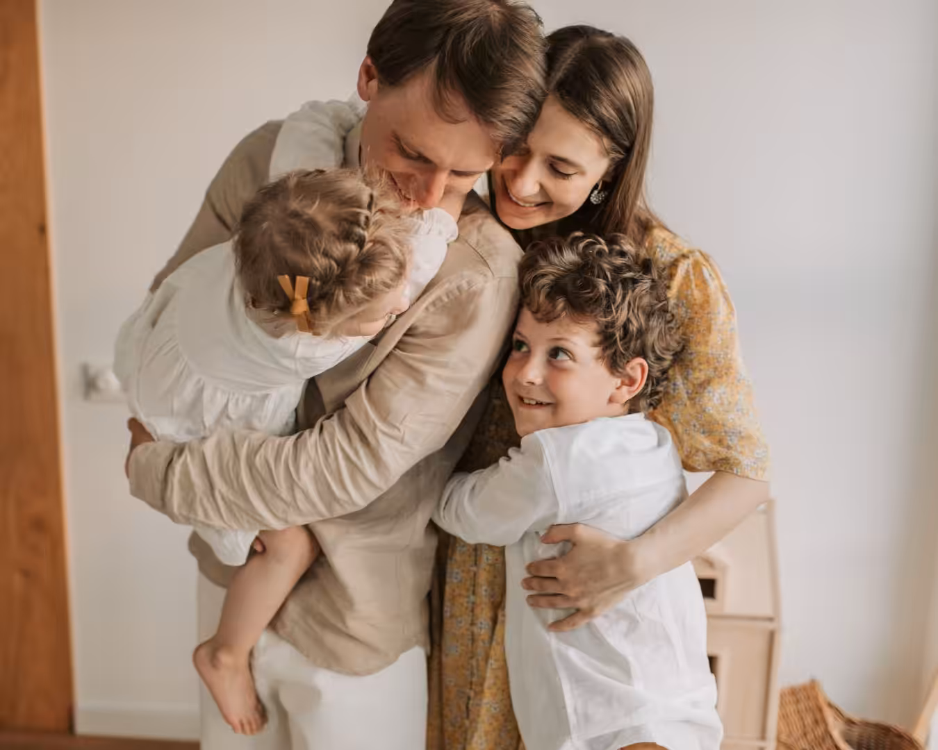 Family of four with two kids smiling